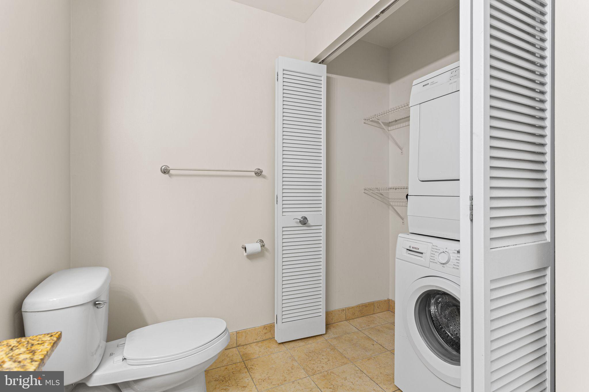 901 North Penn Street, Unit R704 Philadelphia, PA 19123 - Photo 16 of 41 a white toilet sitting next to a bathroom sink