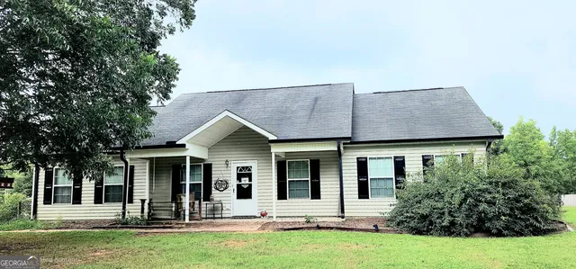 front view of a house with a yard