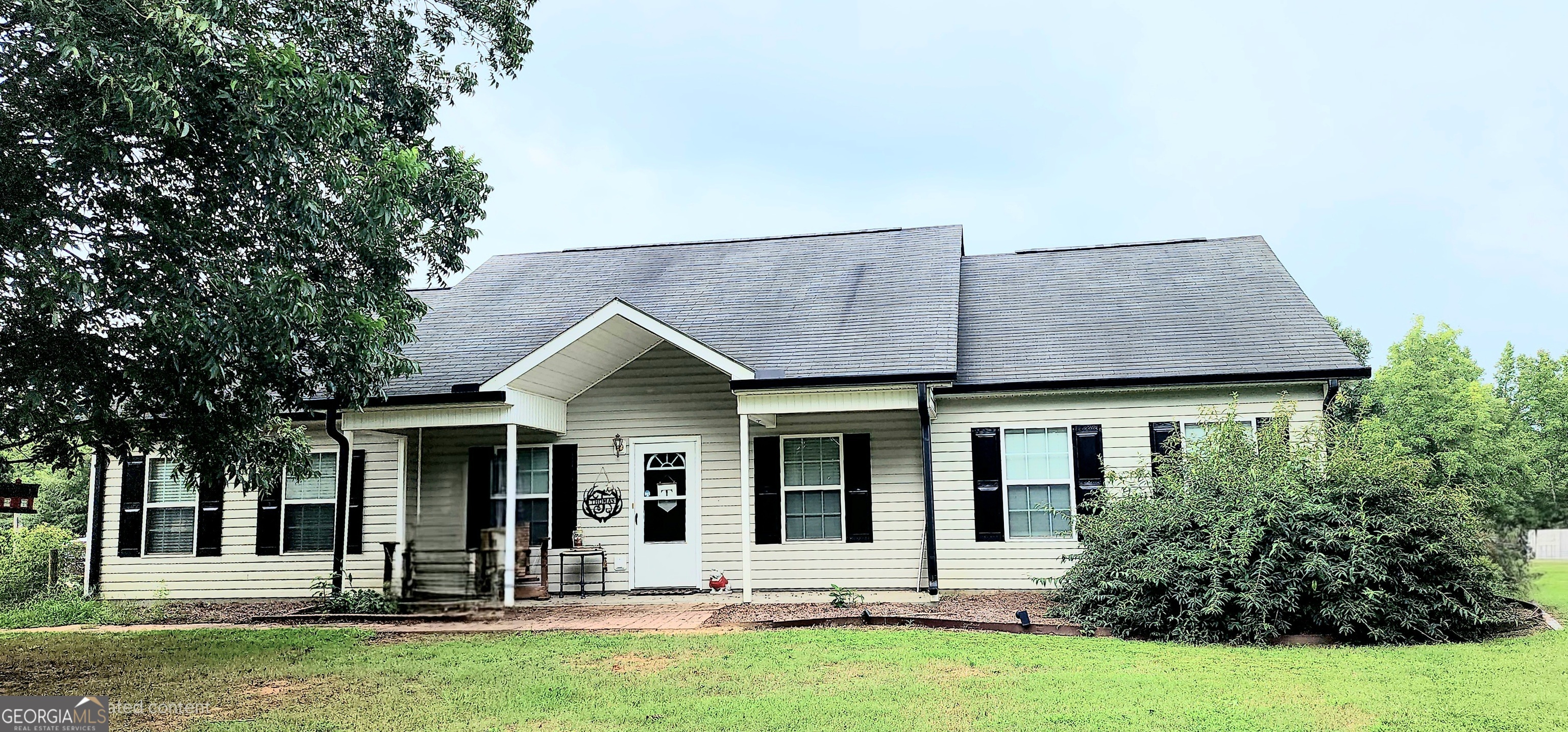 front view of a house with a yard