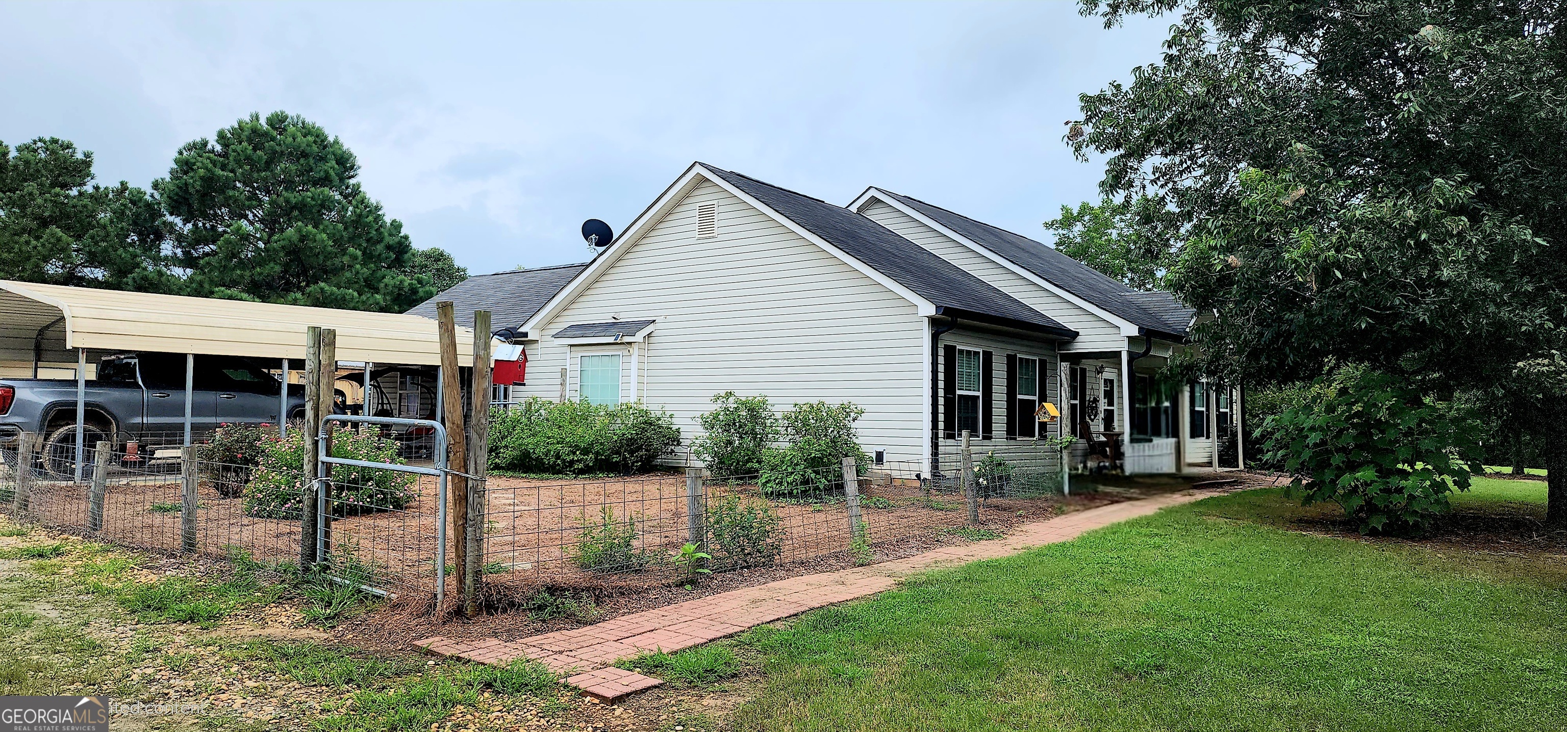 1579 Bates Road Concord, GA 30206 - Photo 14 of 52 a view of a house with backyard and a tree