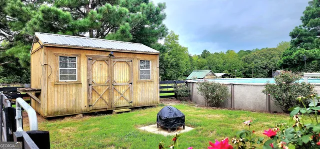a backyard of a house with lots of green space