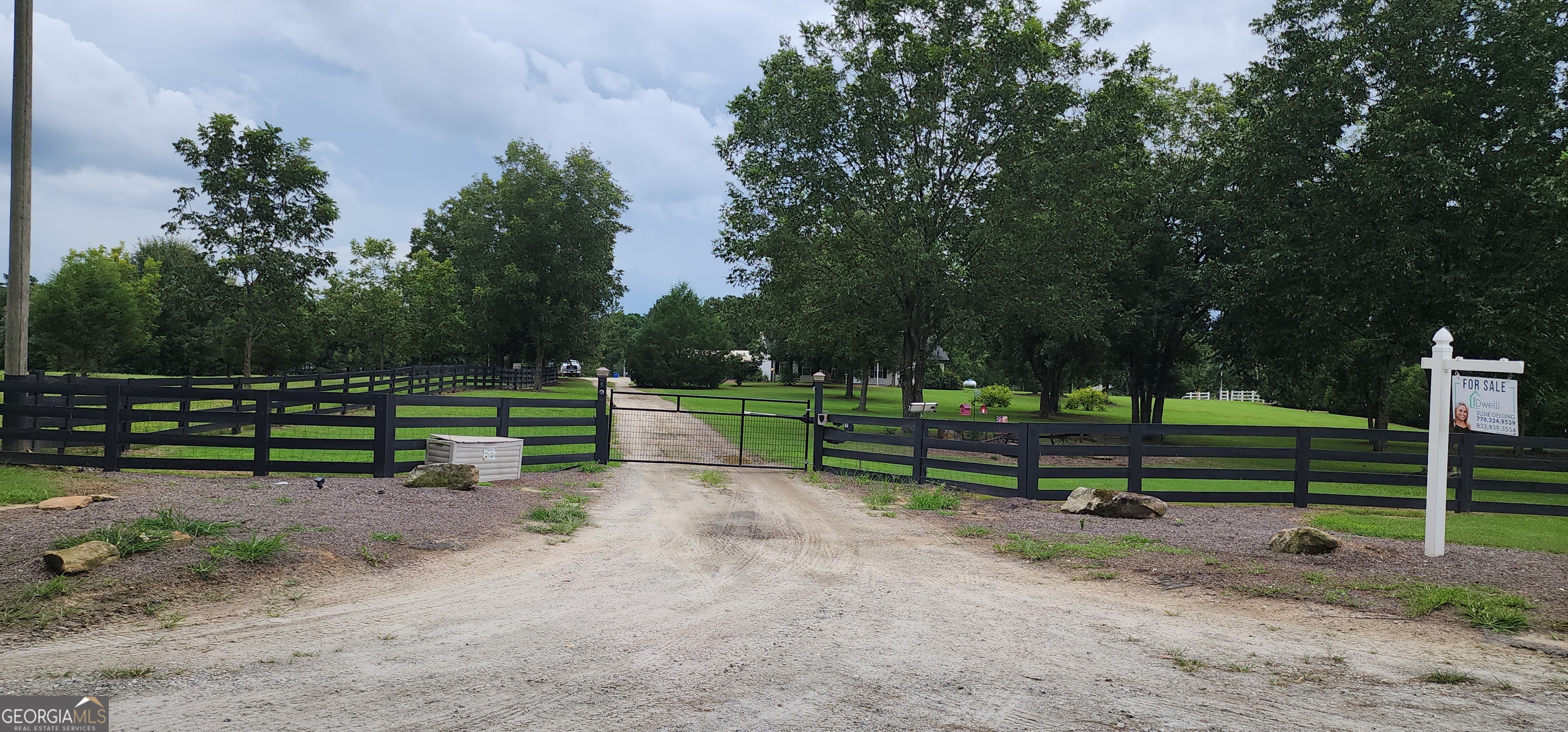 1579 Bates Road Concord, GA 30206 - Photo 2 of 52 a view of park benches sitting below a green tree