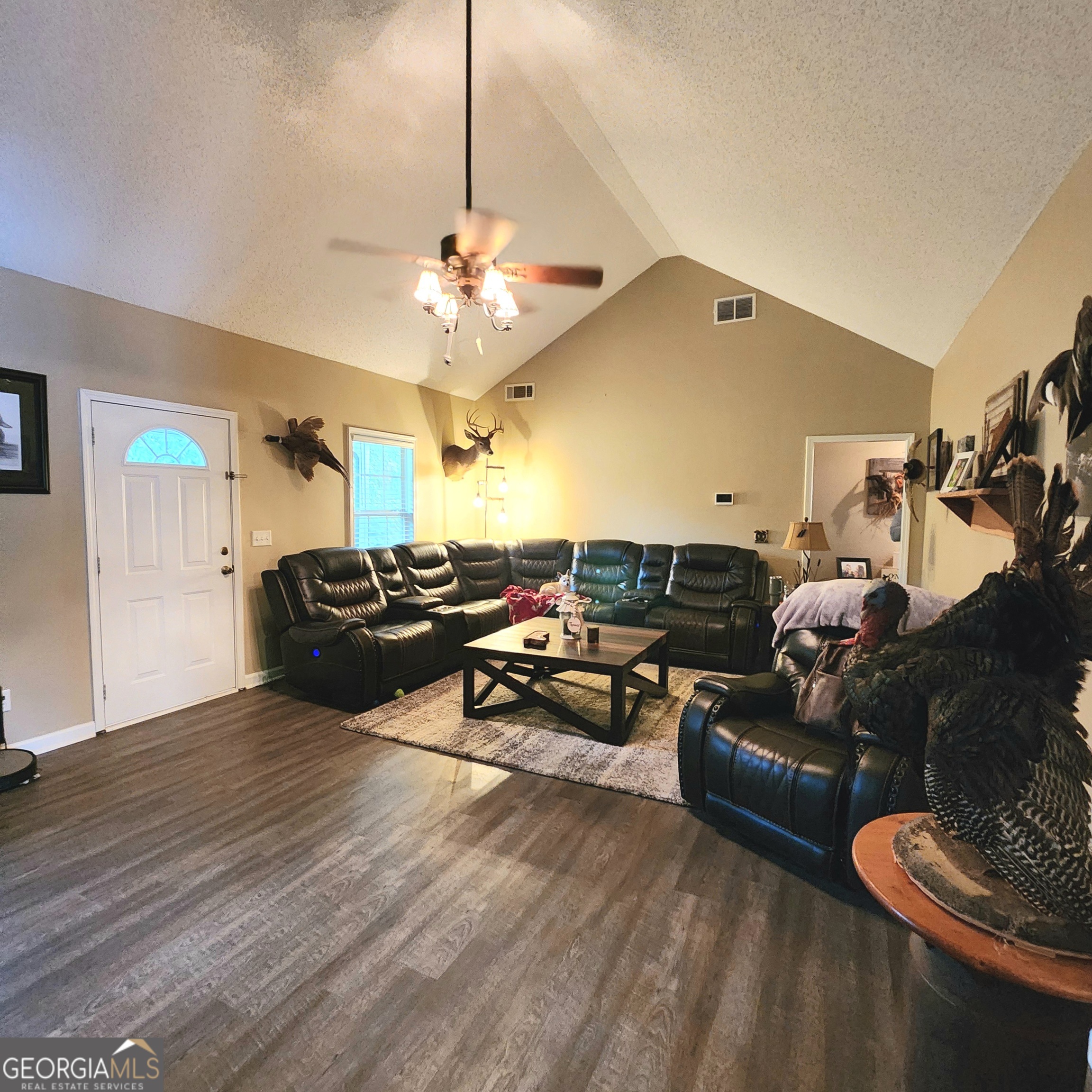 1579 Bates Road Concord, GA 30206 - Photo 26 of 52 a living room with furniture and a chandelier