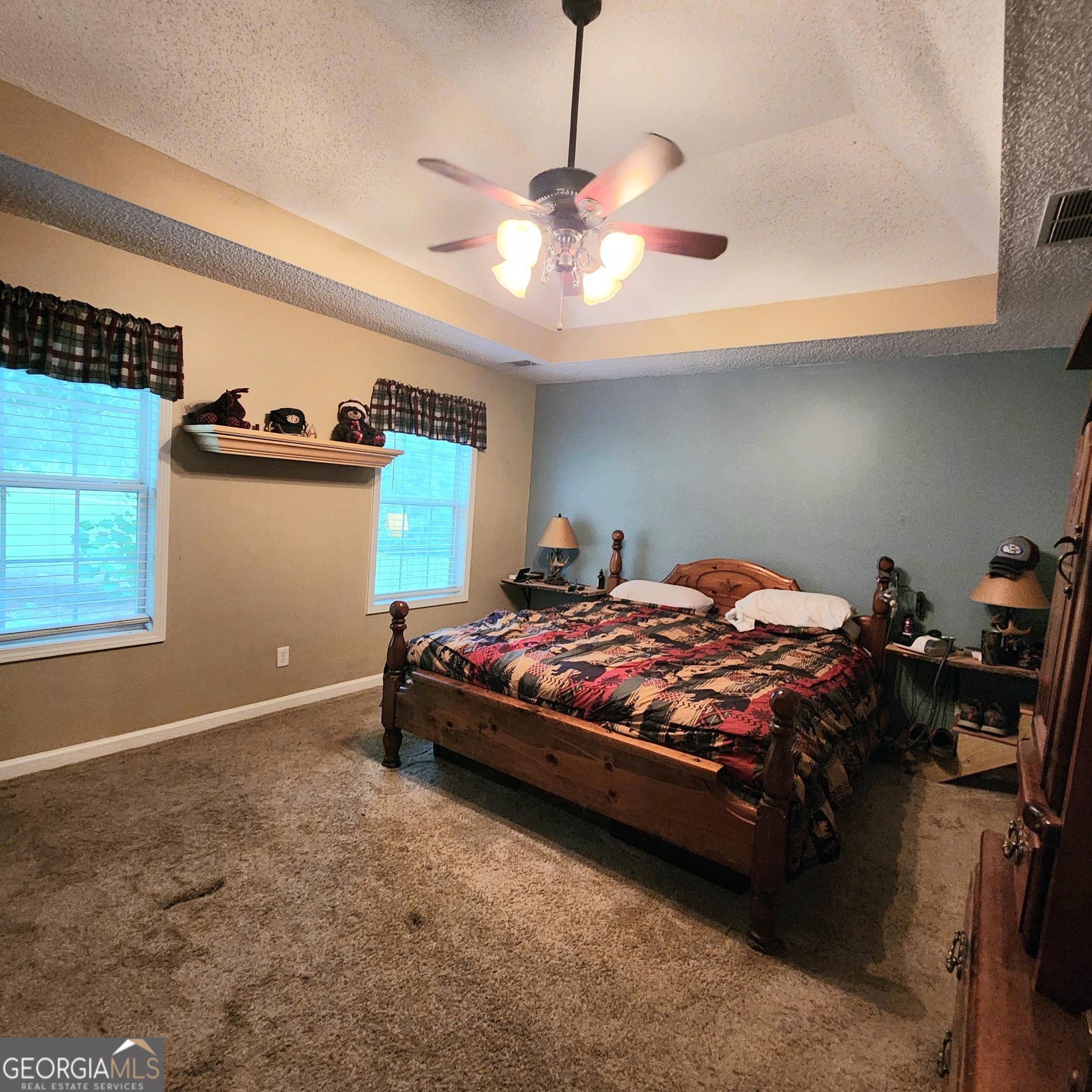 1579 Bates Road Concord, GA 30206 - Photo 29 of 52 a bedroom with a bed and a ceiling fan