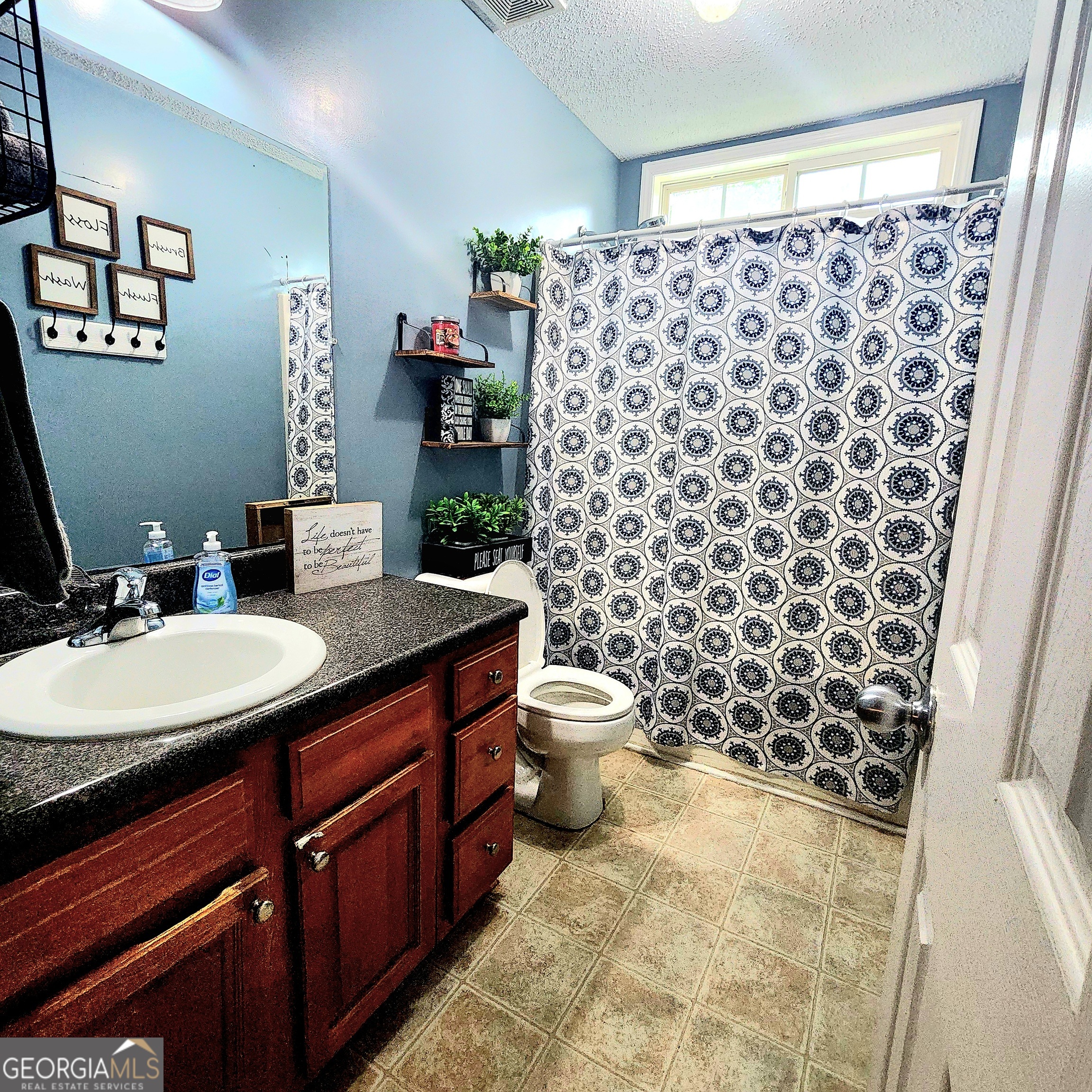 1579 Bates Road Concord, GA 30206 - Photo 34 of 52 a bathroom with a sink toilet and shower
