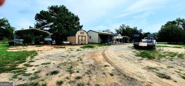 a front view of a house with a yard and porch