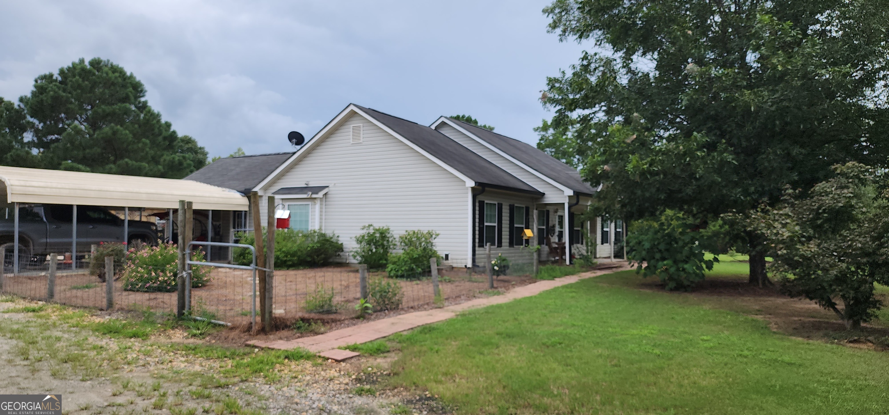 1579 Bates Road Concord, GA 30206 - Photo 47 of 52 a front view of house with a garden and patio