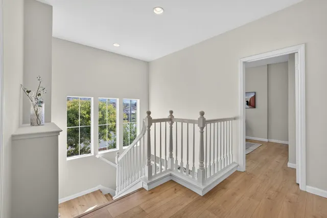 a view of a hallway with windows