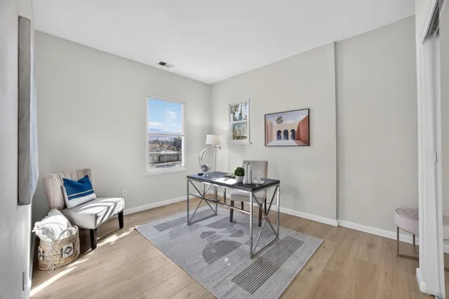 a workspace with furniture and wooden floor