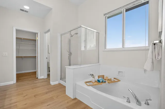 a bathroom with a bathtub and a shower