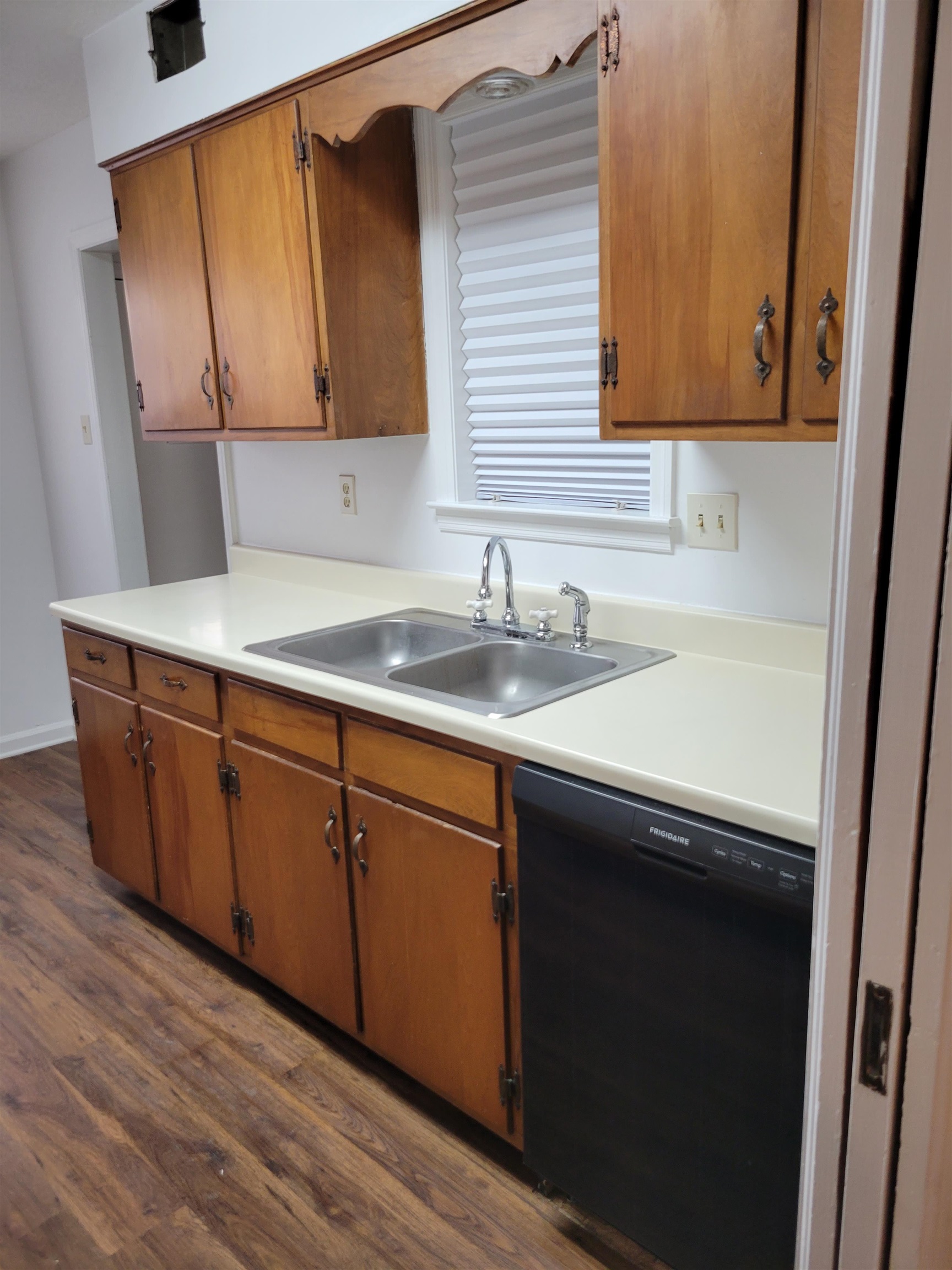 3415 Adrick Road Memphis, TN 38128 - Photo 14 of 22 a kitchen with sink and cabinets