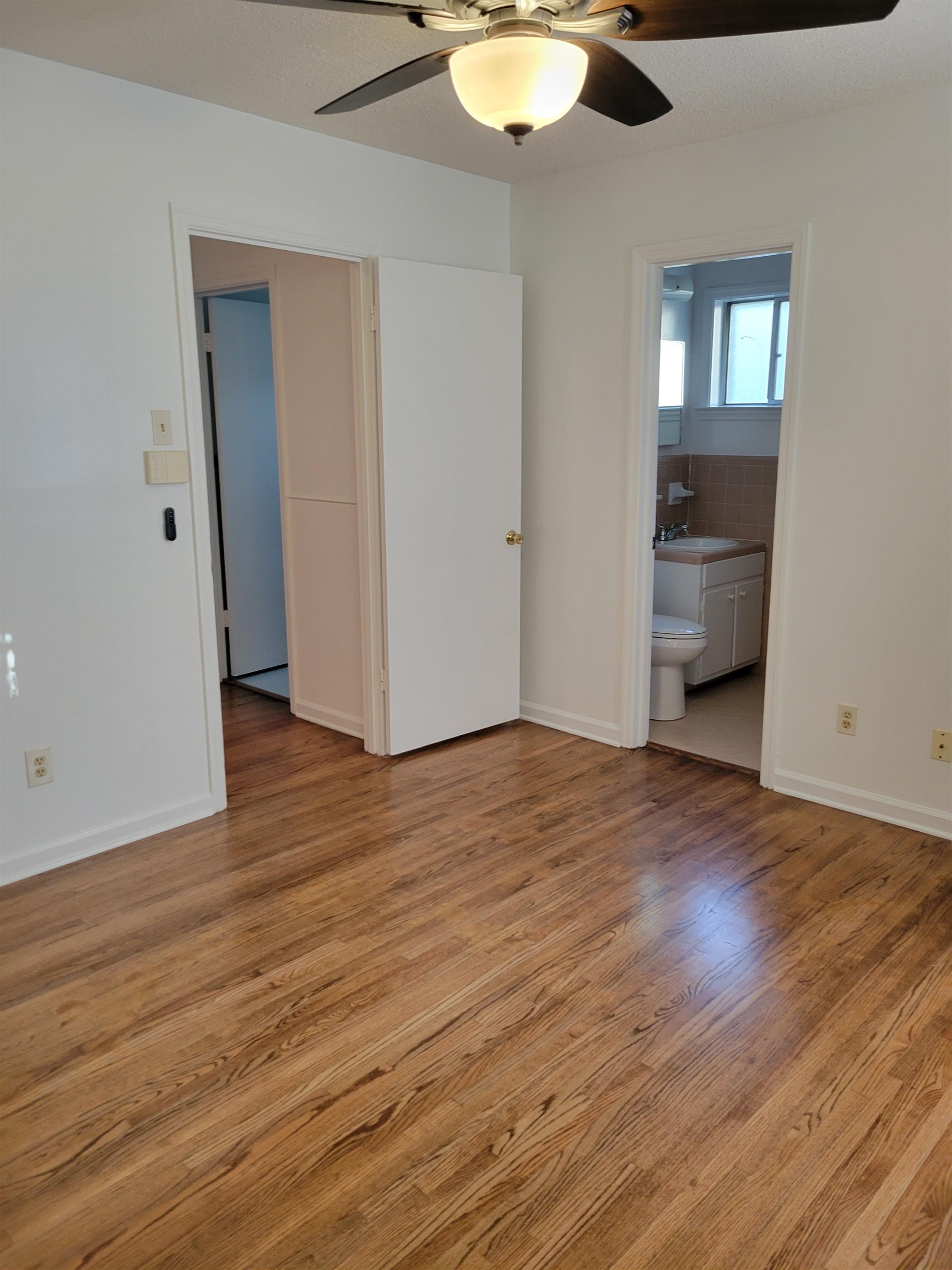 3415 Adrick Road Memphis, TN 38128 - Photo 18 of 22 a view of empty room with wooden floor