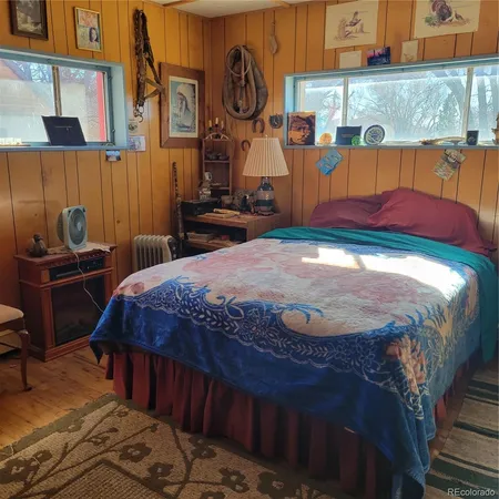 a front view of a house with a garden and sitting area