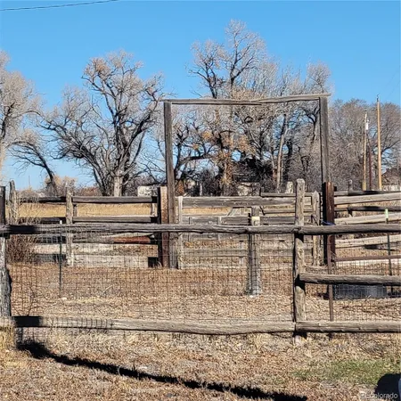 a view of a chairs and table in the patio