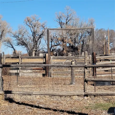 a view of a chairs and table in the patio
