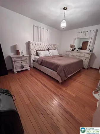 a bedroom with bed and window