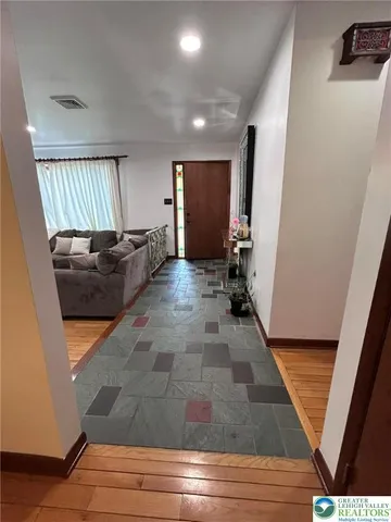 a living room with furniture and a rug