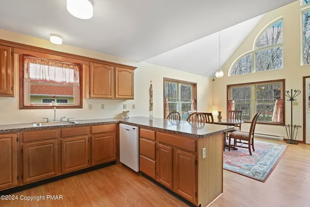a bathroom with a toilet a sink and a mirror