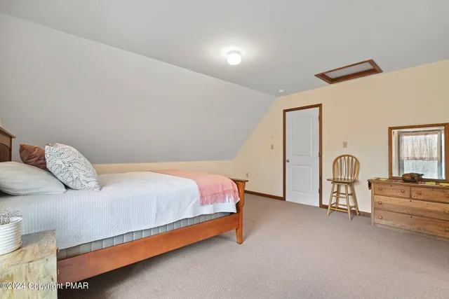 a view of a house with wooden deck