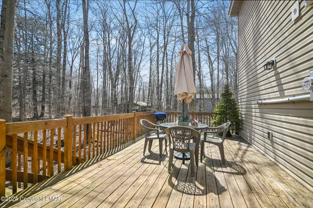 a view of a chairs and table on the wooden floor