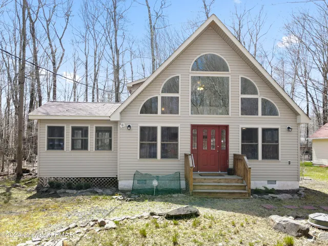 a living room with fireplace furniture and a flat screen tv