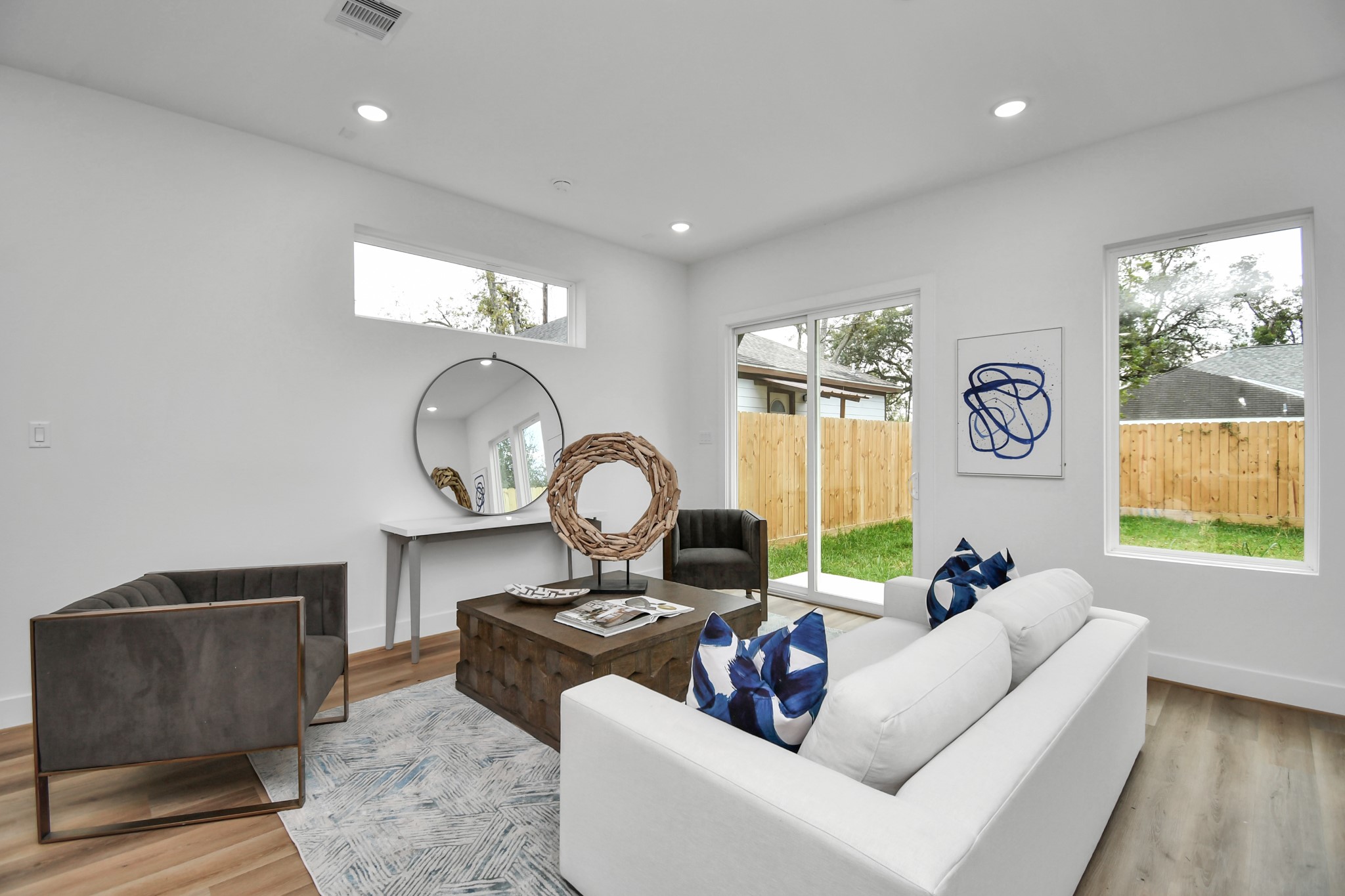 2610 Vance Street Houston, TX 77093 - Photo 11 of 30 a living room with couches a mirror and a large window
