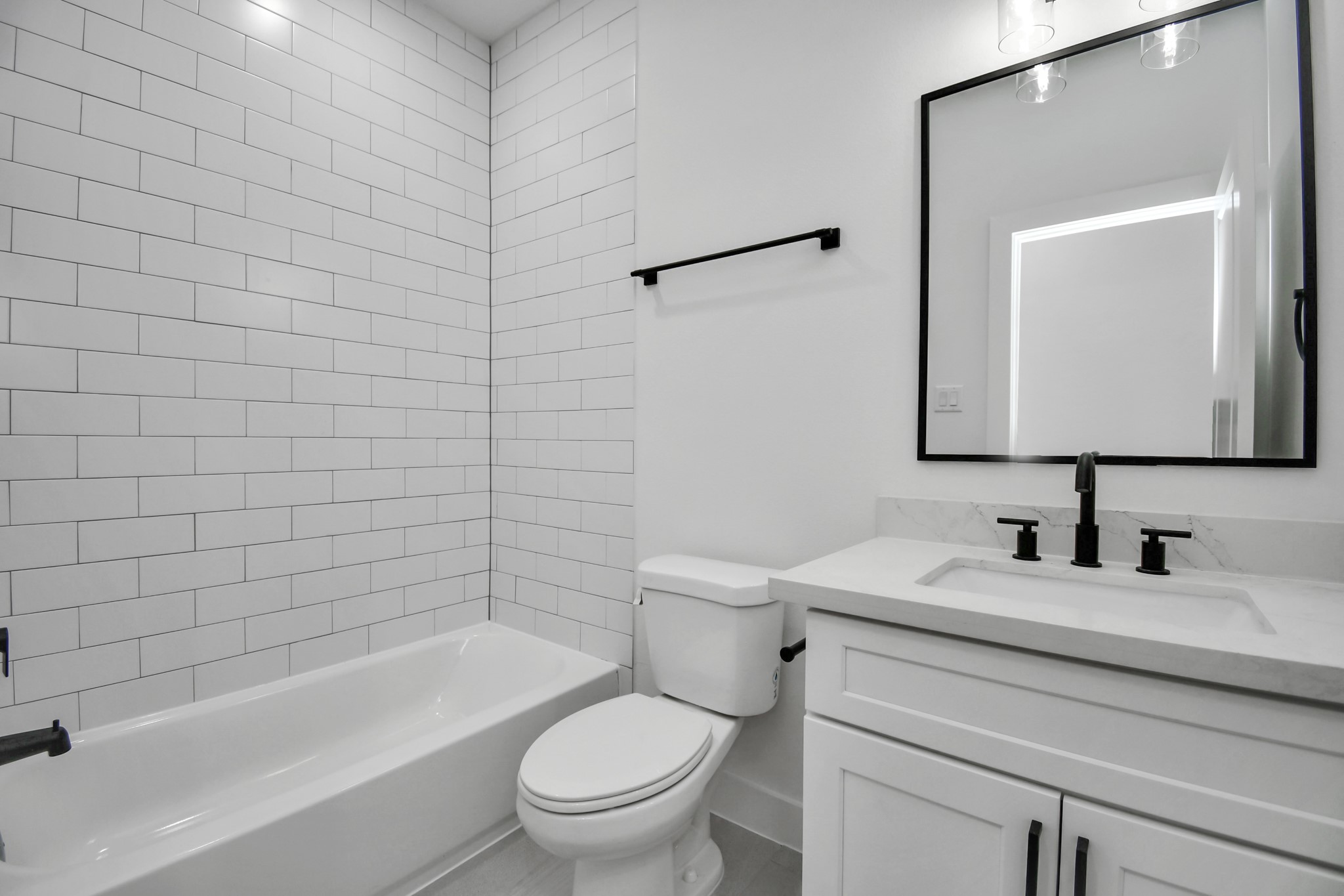2610 Vance Street Houston, TX 77093 - Photo 23 of 30 a bathroom with a toilet a sink and bathtub