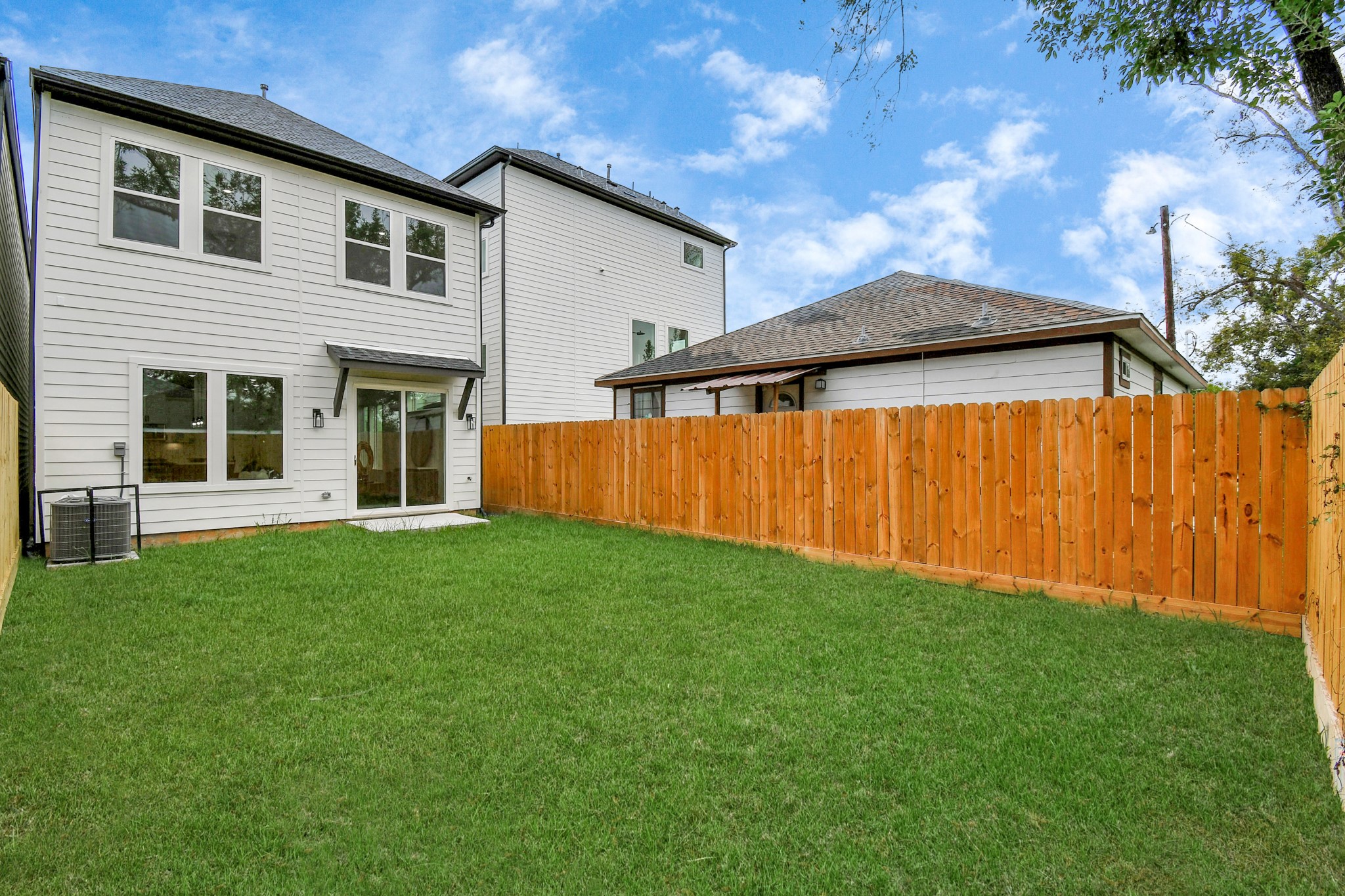 2610 Vance Street Houston, TX 77093 - Photo 28 of 30 a view of a backyard with plants and a barbeque