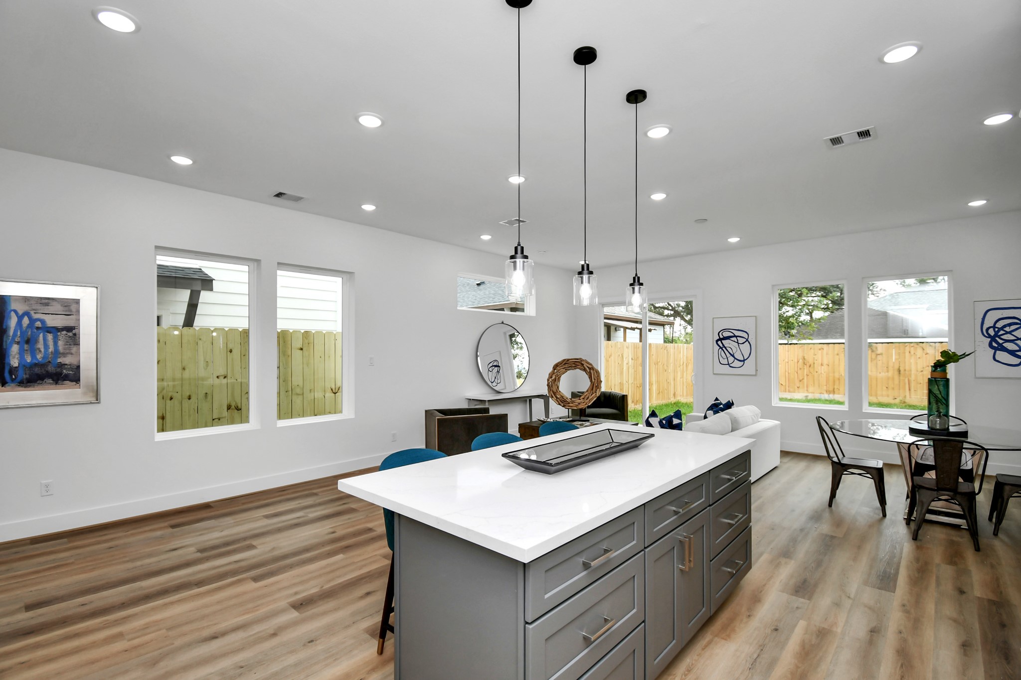 2610 Vance Street Houston, TX 77093 - Photo 8 of 30 a kitchen with a stove a counter space a large window and furniture
