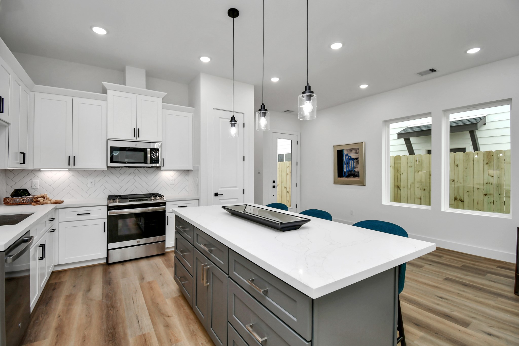 2610 Vance Street Houston, TX 77093 - Photo 9 of 30 a kitchen with a stove a sink and a refrigerator