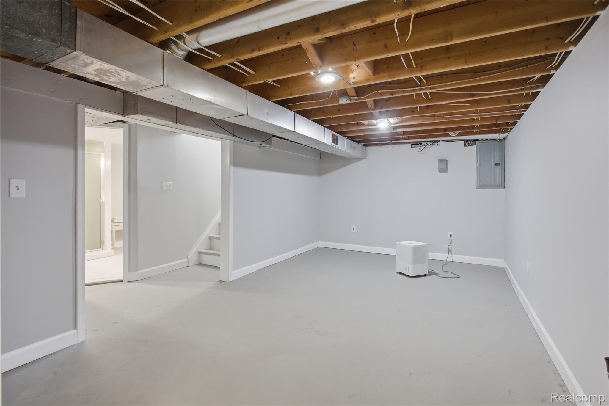 37257 Dundee Street Sterling Heights, MI 48310 - Photo 29 of 47 Spacious lower level with light gray walls and a painted concrete floor