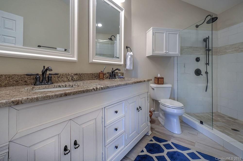 1133 Torrence Circle Davidson, NC 28036 - Photo 13 of 25 a bathroom with a sink toilet and shower