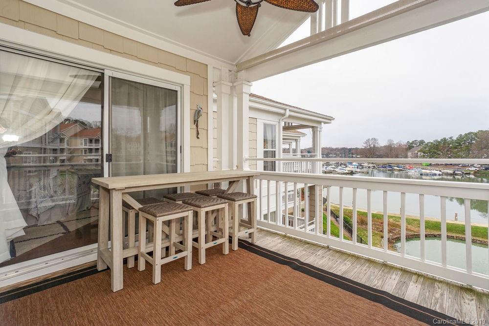 1133 Torrence Circle Davidson, NC 28036 - Photo 17 of 25 a view of a balcony with chairs