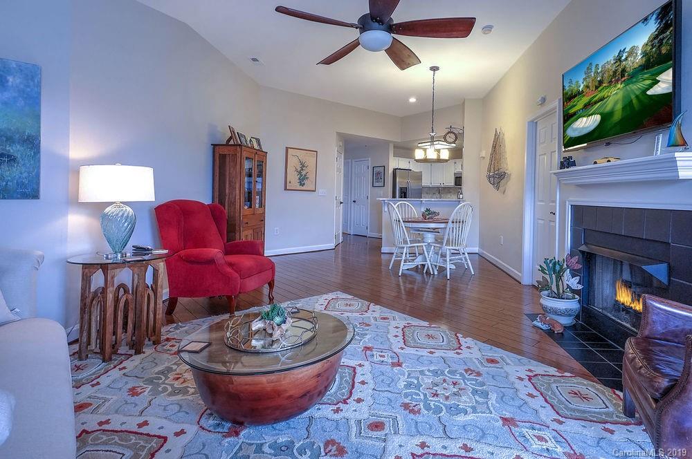 1133 Torrence Circle Davidson, NC 28036 - Photo 4 of 25 a living room with furniture and a fireplace