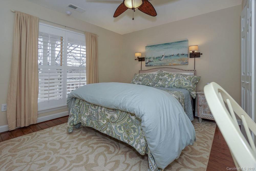 1133 Torrence Circle Davidson, NC 28036 - Photo 7 of 25 a bedroom with a bed and a large window