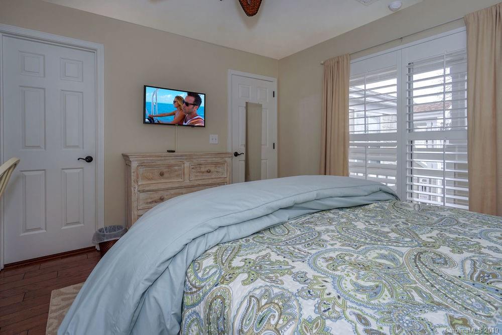 1133 Torrence Circle Davidson, NC 28036 - Photo 8 of 25 a bedroom with a bed and a window