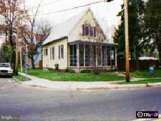 320 Warwick Road Magnolia, NJ 08049 - Photo 1 of 1 a front view of a house with a yard and garage