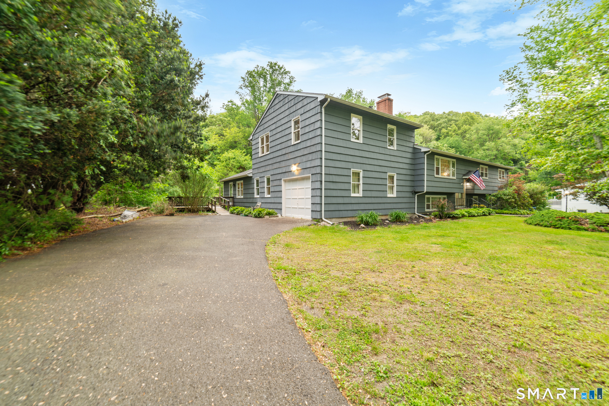 91 Booth Hill Road Shelton, CT 06484 - Photo 23 of 39 Additional living space side with full garage and private entrance, deck.