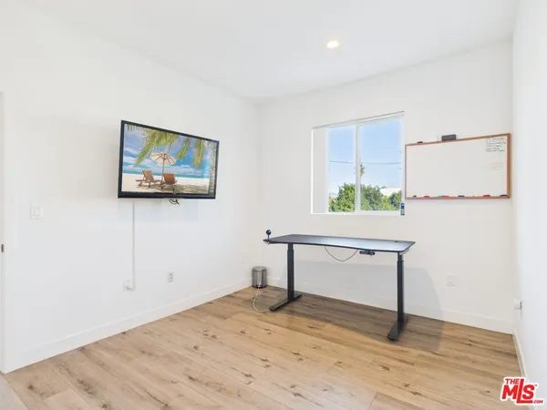 a view of a livingroom with furniture and wooden floor