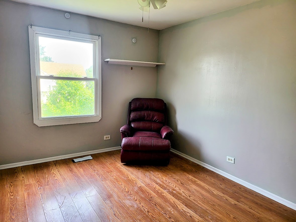 719 Radnor Drive Roselle, IL 60172 - Photo 15 of 18 a room with toys and a wooden floor