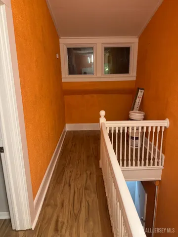 a balcony with wooden floor