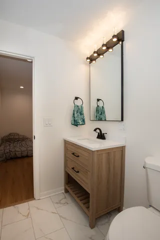 a bathroom with a sink and a mirror
