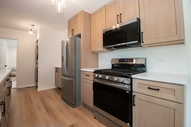 a kitchen with a stove and a microwave