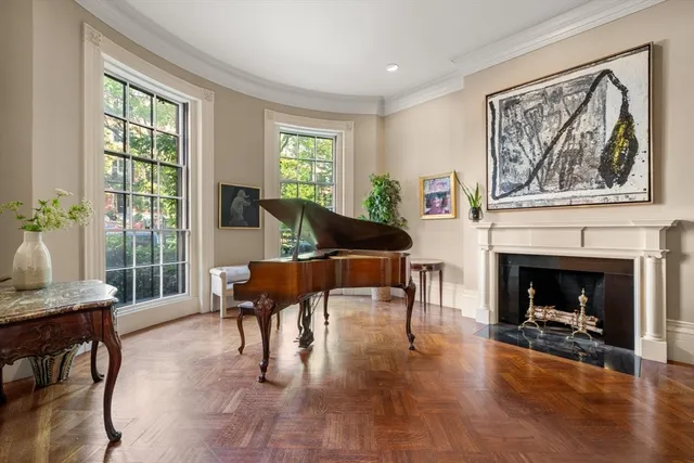 a balcony with furniture and a potted plant