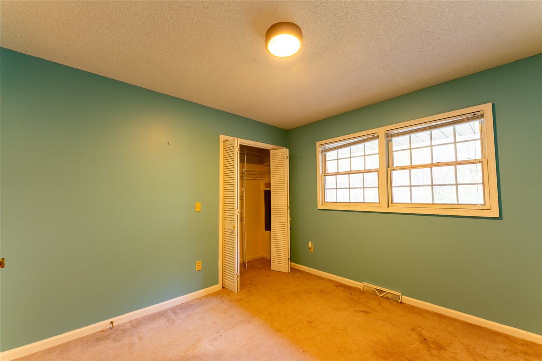 139 Todds Creek Road Central, SC 29630 - Photo 25 of 45 This cozy bedroom features carpeted floors and a window for natural light.