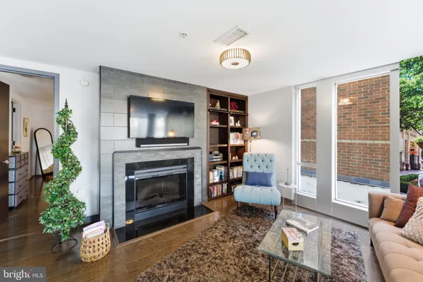 a kitchen with stainless steel appliances kitchen island granite countertop a refrigerator and a stove top oven