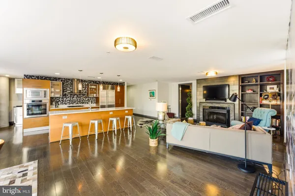 a kitchen with stainless steel appliances granite countertop a stove and a sink