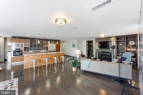 a kitchen with stainless steel appliances granite countertop a stove and a sink