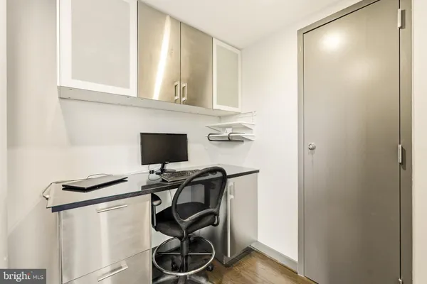 a large kitchen with kitchen island a sink appliances and a counter top space