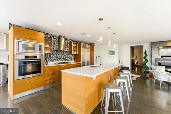 a living room with fireplace furniture and a flat screen tv